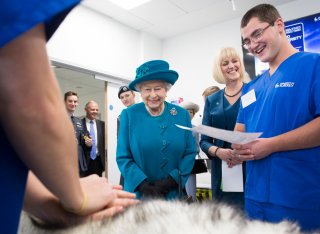 Trainee vet, Dan Letch, standing next to HM The Queen