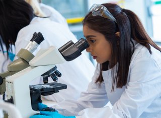 Student using a microscope