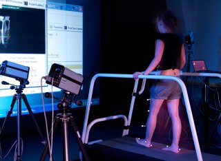 A person on a treadmill in the human movement lab.