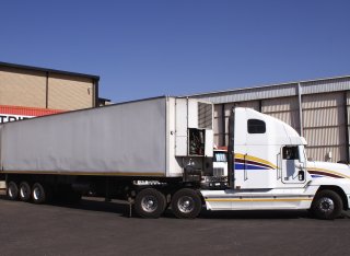 Articulated lorry manouvering onto a dock