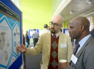 People looking at poster during the event