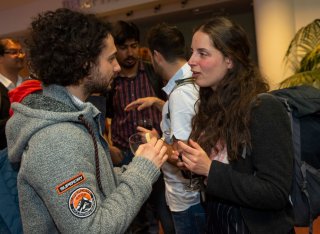 People socialising after the Roland Clift lecture by Joanna Yarrow