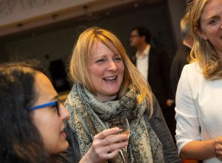 Women laughing at socialising event after Roland Clift lecture by Joanna Yarrow