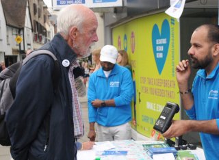 GCARE member talking to member of the public at Car Free Day