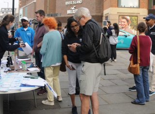 GCARE team talking to people at the Car Free Day event