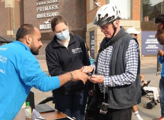 GCARE team talking to the community at Car Free Day