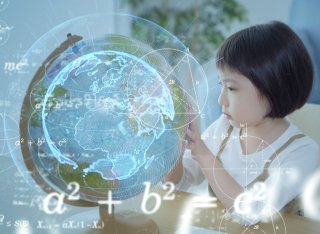 A child looks at a globe. Digital representations of information appear over the top