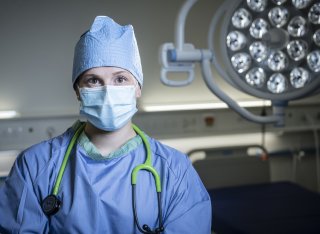 Medical School student in surgical gown