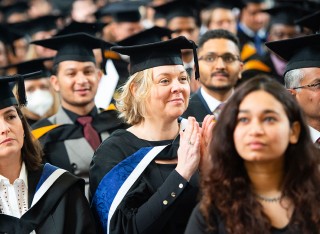 Students clapping at graduation