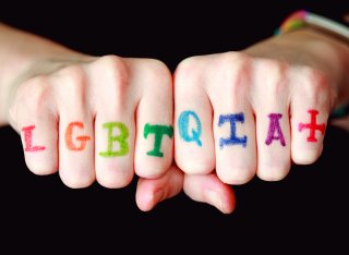 LGBTQIA + written on hands