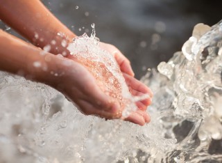 Hands in water