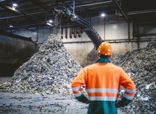 Construction worker looking at a pile