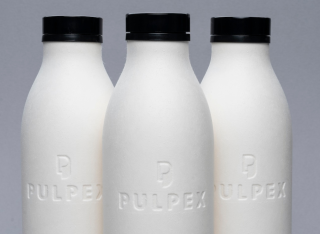 Three Pulpex paper fibre bottles displayed on a grey background