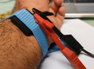 TRIPULSE pulse device being tested on the wrist