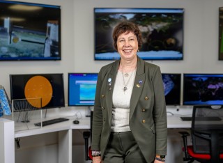 Dr Nicola Fox in the control room at the Surrey Space Centre