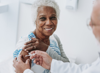 stock image of a patient receiving a vaccine