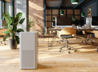 stock photo of a pleasant office environment with an air purifier in the foreground