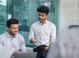 Two people discussing work