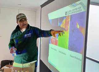 Speaker delivering public climate science workshop