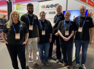 AI4ME showcase. Group of researchers at event