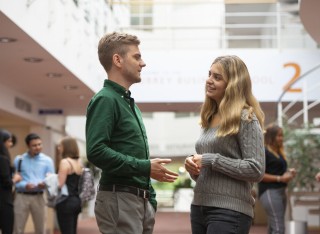Students chatting as Surrey Business School