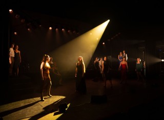 Production still of cast in 'Beginners Please!', performance by GSA Cert HE Foundation students' production