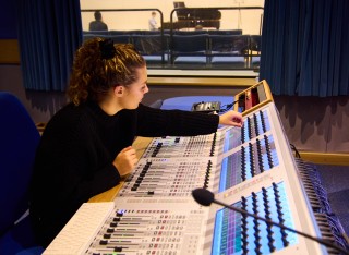 An image of a Tonmeister student using equipment from Studer
