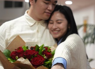 A photograph of Lok Kio Wong and Wing Han Hui after getting engaged