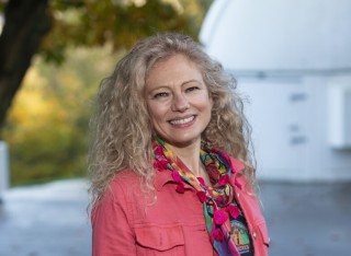 Dr Noelia Noel near a space observatory
