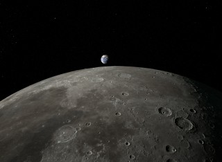 Planet Earth rising over the surface of the Moon in the distance