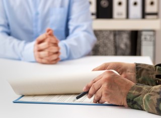 Army and business man at desk
