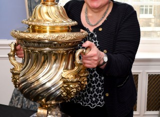 University of Surrey's Professor Sabine Braun holding the Chartered Institute of Linguists' CIOL Threlford Cup, June 2026
