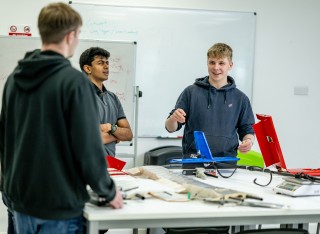 Aerospace students collaborating on a project