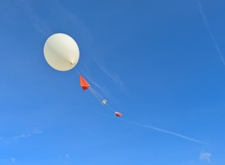 Giant balloon flying into the atmosphere 