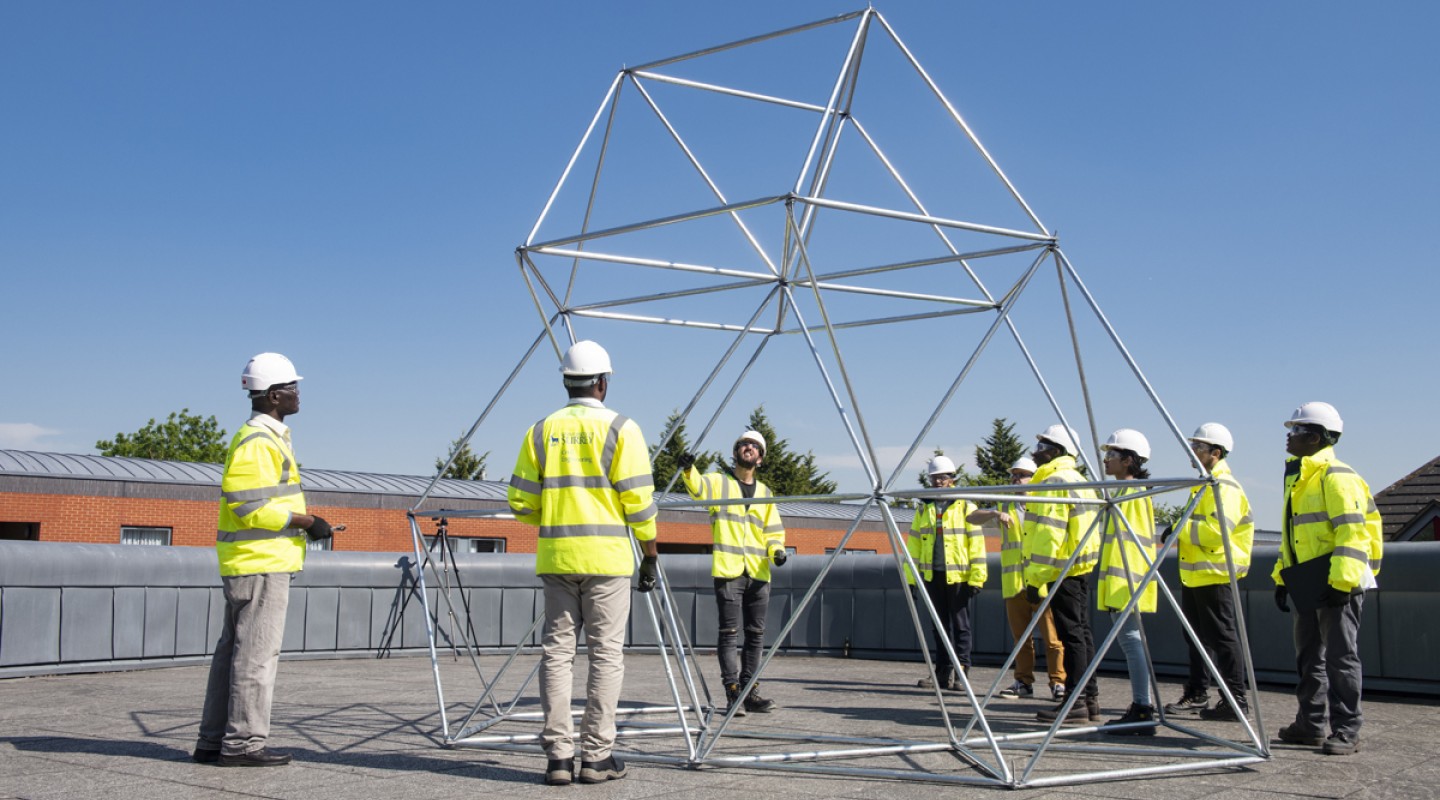 Students building a structure as part of the DAD project