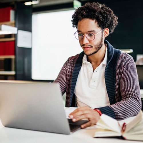 Man sat working on laptop