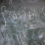 maths equations in chalk on a blackboard