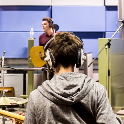 Male student playing the guitar