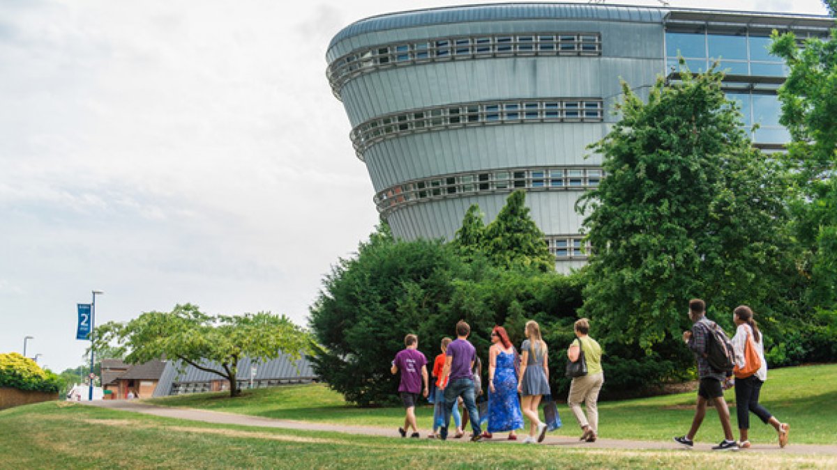 Group of people walking beside the Duke of Kent building