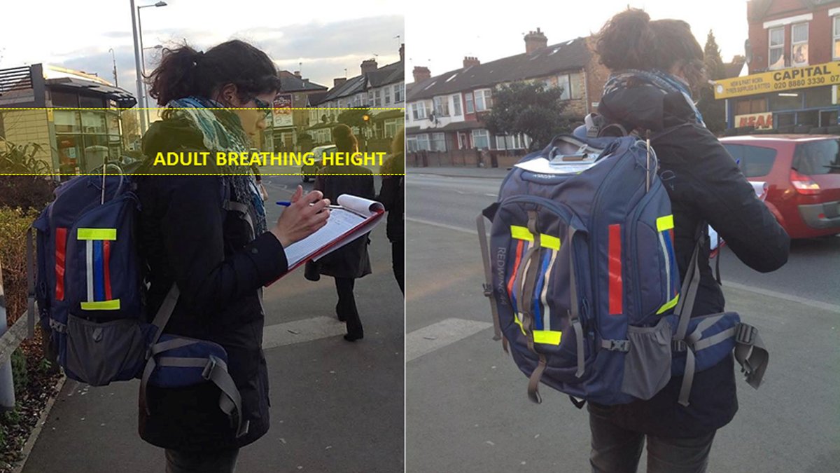 Woman on street with clip board