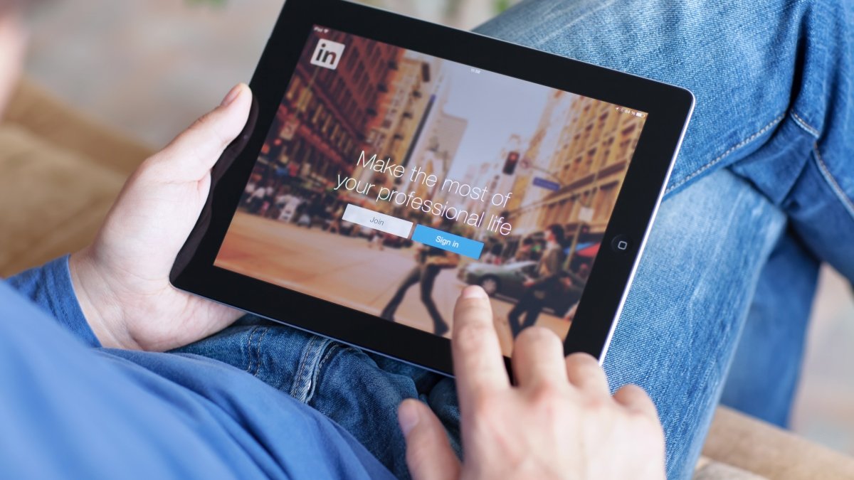 Person using LinkedIn on a tablet