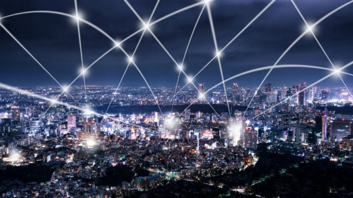 Aerial view of city and 5g waves