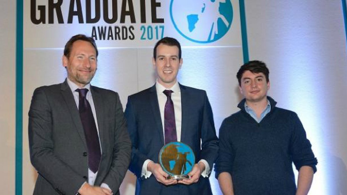 Graduates accepting award