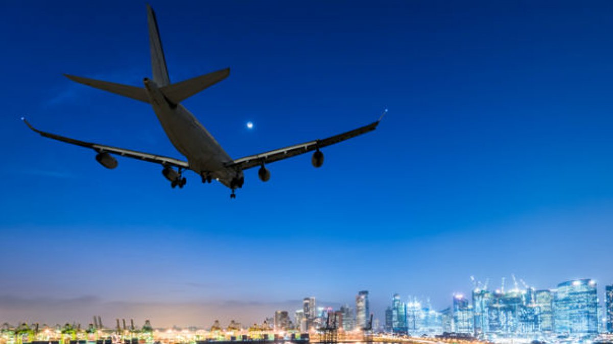 Aeroplane landing over city