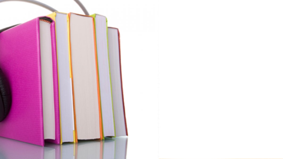 Books with headphones on top of them