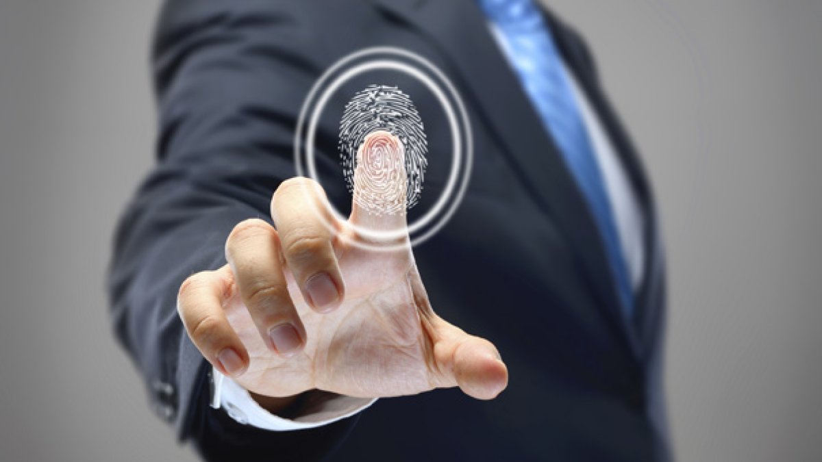 Person pressing finger on glass