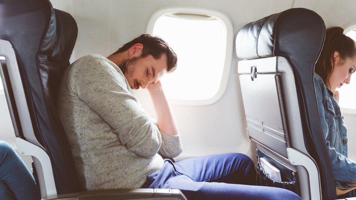 Person on plane sleeping
