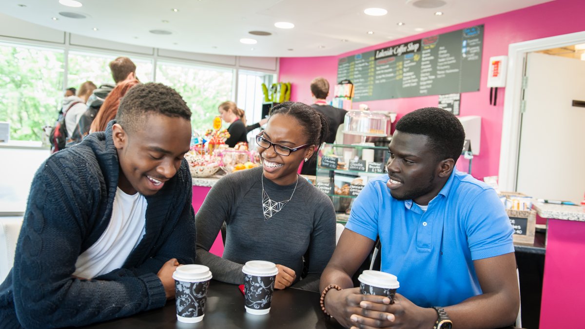 Students talking and drinking coffee