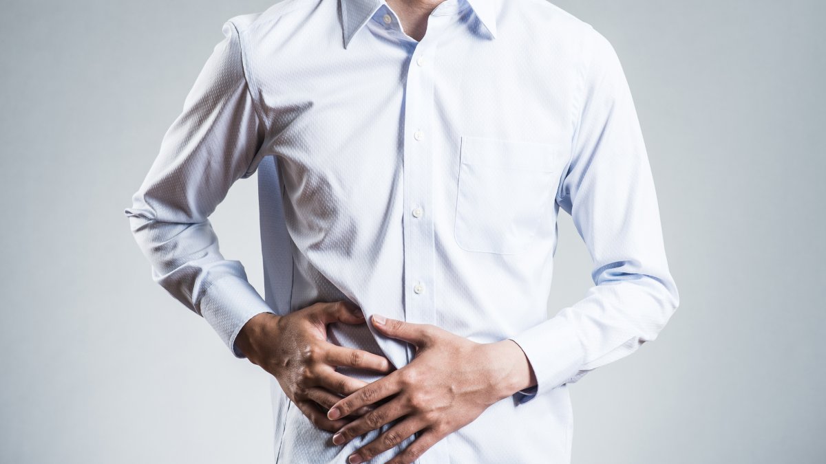 Person clutching their side in pain