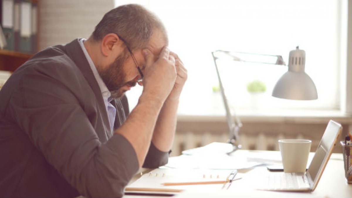 man sitting an desk